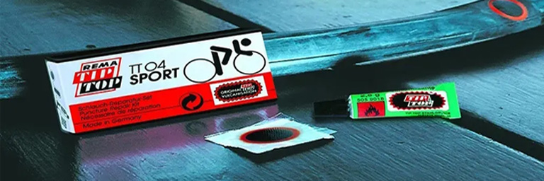 Rema Tip Top puncture repair kit in front of bike